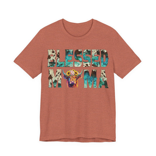 Front: Blessed Mama Bella Canvas 3001 shirt with turquoise cow print lettering and floral Highland cow graphic on soft southern color tee