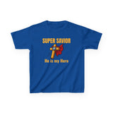 Front view of kids “SUPER SAVIOR / Jesus Is My Superhero” t-shirt — orange bold text, cape-and-shield emblem with cross, centered graphic on white kids tee.