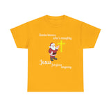 Santa Knows Who’s Naughty, Jesus Forgives Anyway – Heavy Cotton Unisex Christian T-Shirt, Funny Christmas Faith Tee
