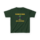 Front — Kids Christian T-Shirt “The Might of Heaven — Jesus Is My Superhero” with stylized cross superhero emblem on deep green shirt.