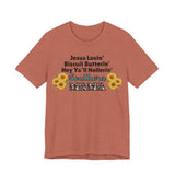 Front of Southern Mama unisex jersey t-shirt featuring sunflowers and faith-inspired text on clay