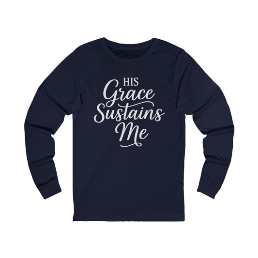 “His Grace Sustains Me — 2 Corinthians 12:9 unisex Christian long sleeve t-shirt, bold faith design on front.”