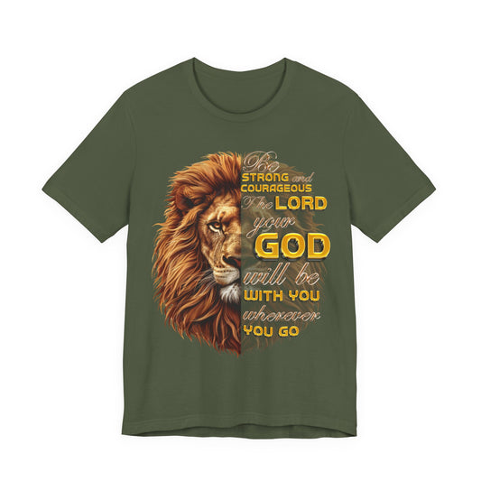 Front: Joshua 1:9 Christian t-shirt with lion graphic, “Be strong and courageous” Scripture design, gold typography on olive green shirt, faith-based apparel