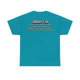 Back of Tropical blue Christian gamer t-shirt displaying John 1:9 Scripture verse in pixel-style block lettering: " The next day John seeth Jesus coming unto him and saith, Behold the Lamb of God which taketh away the sin of the world."